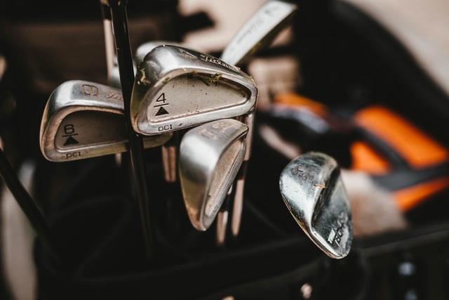 dirty golf irons that need to be cleaned