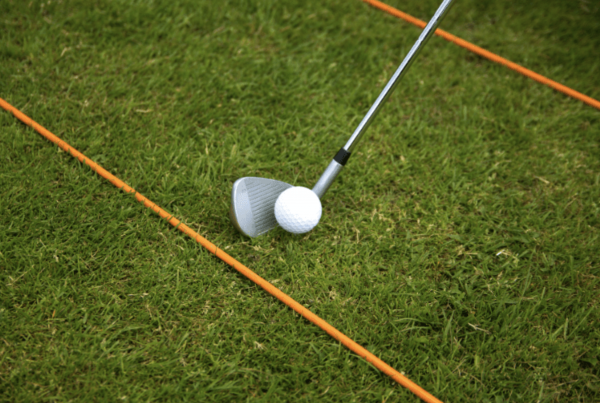 golf alignment sticks on grass