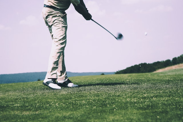 golfer hitting with a 7 iron