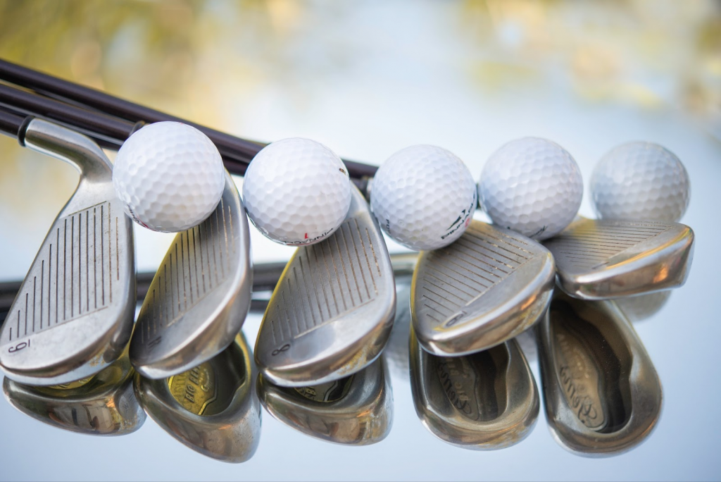 various clubs and golf balls