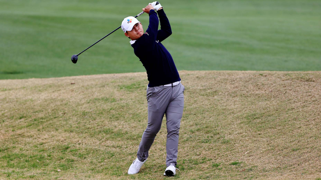 golfer completing follow through on swing